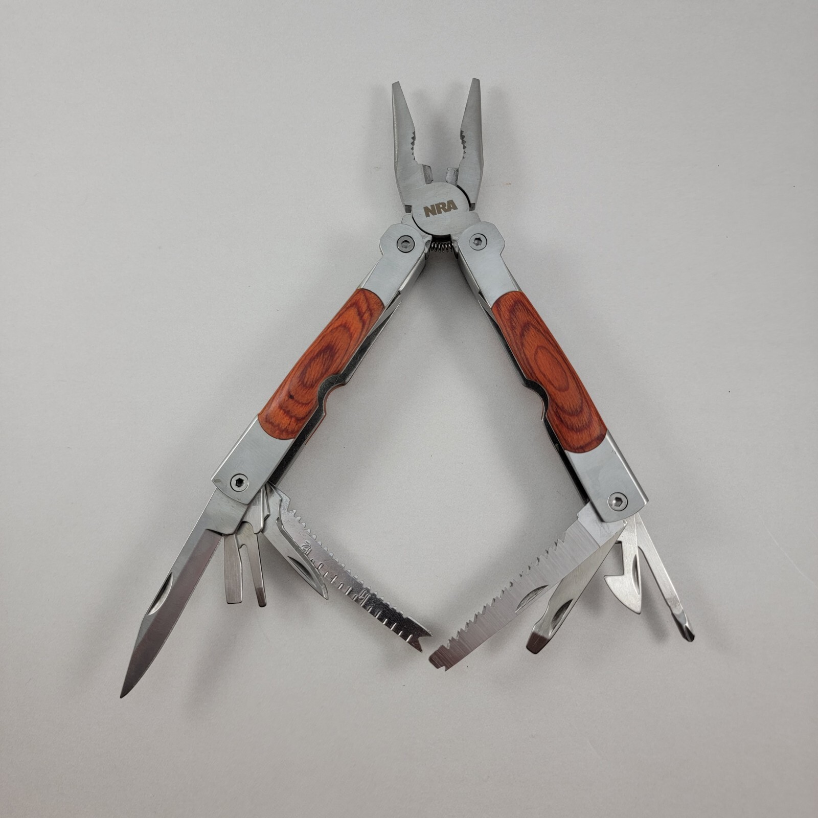 NRA Multi Tool – 4.5″ With Sheaf – Pliers, Knife, Can Opener & More – CLEAN