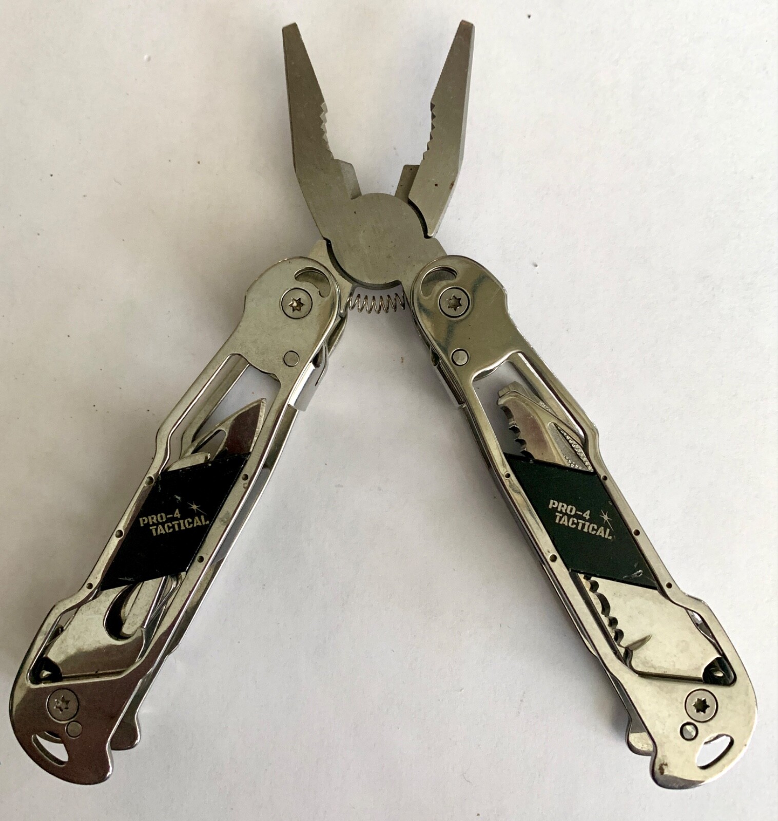PRO-4 POWER TACTICAL 12-IN-1 MULTI-TOOL PLIERS, CHROME TONE METAL & BLACK