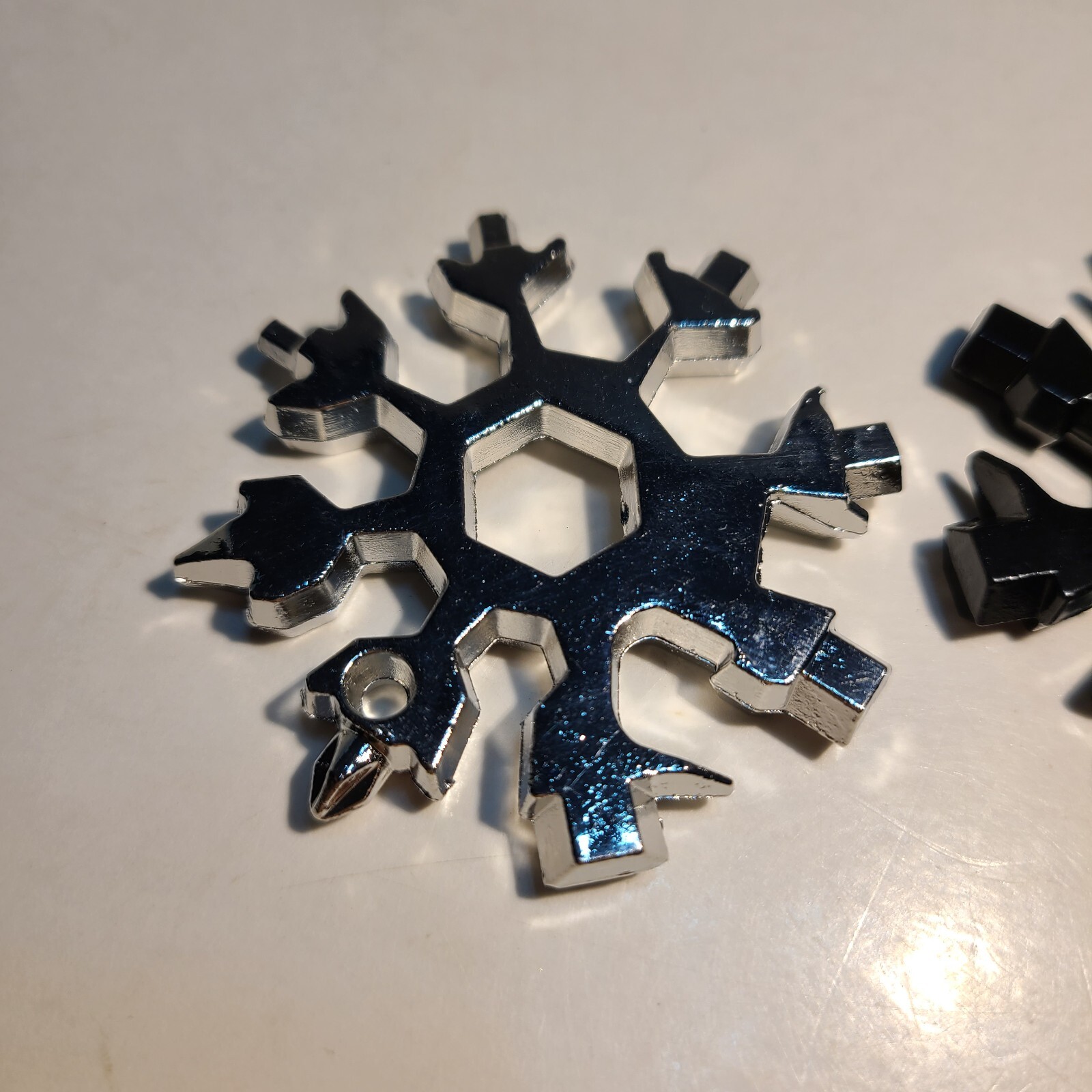 18-in-1 Stainless Steel Snowflake Multi-Repair Tool with Bottle Opener, etc.