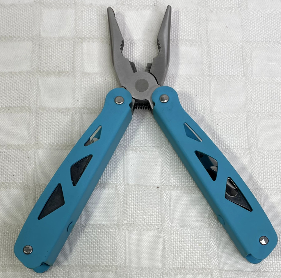 Ozark Trail 12-in-1 Multi Tool with Nylon Black Sheath Teal Blue handle.