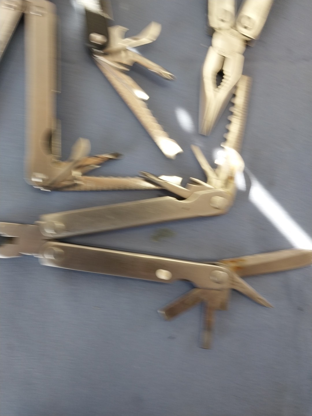4 multi tools pliers screwdriver knife saw