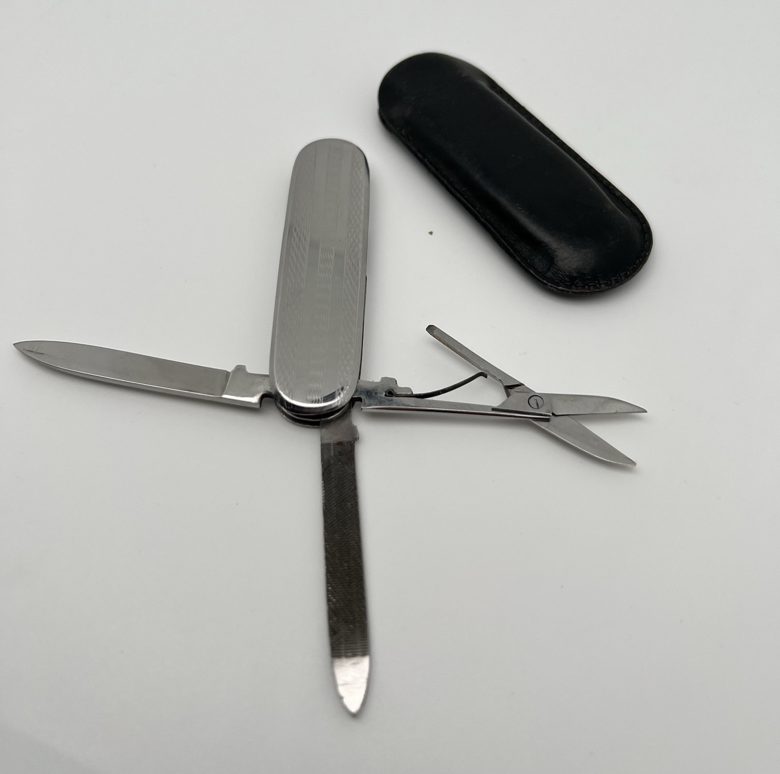 Multi-tool with blade, scissors and file