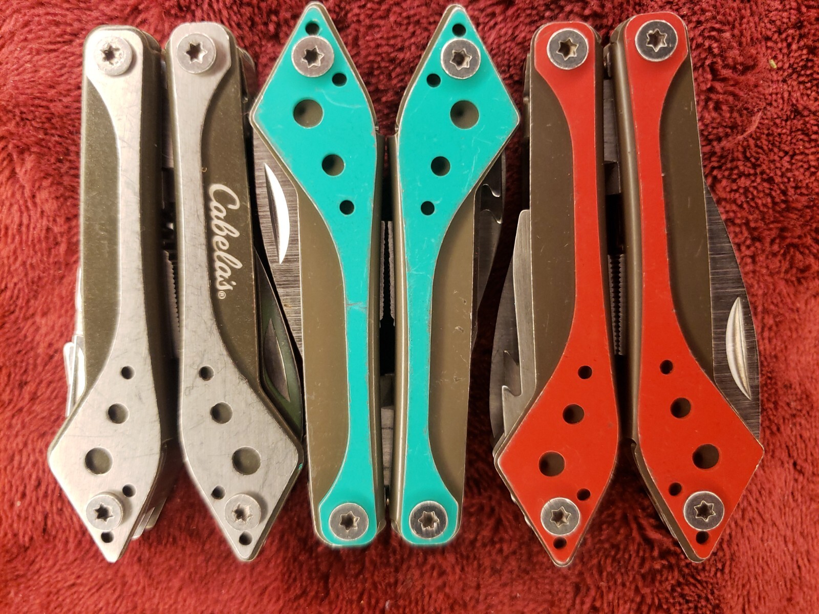 Lot of three Cabela’s Multi Tool Stainless Clear, Teal Green & Red