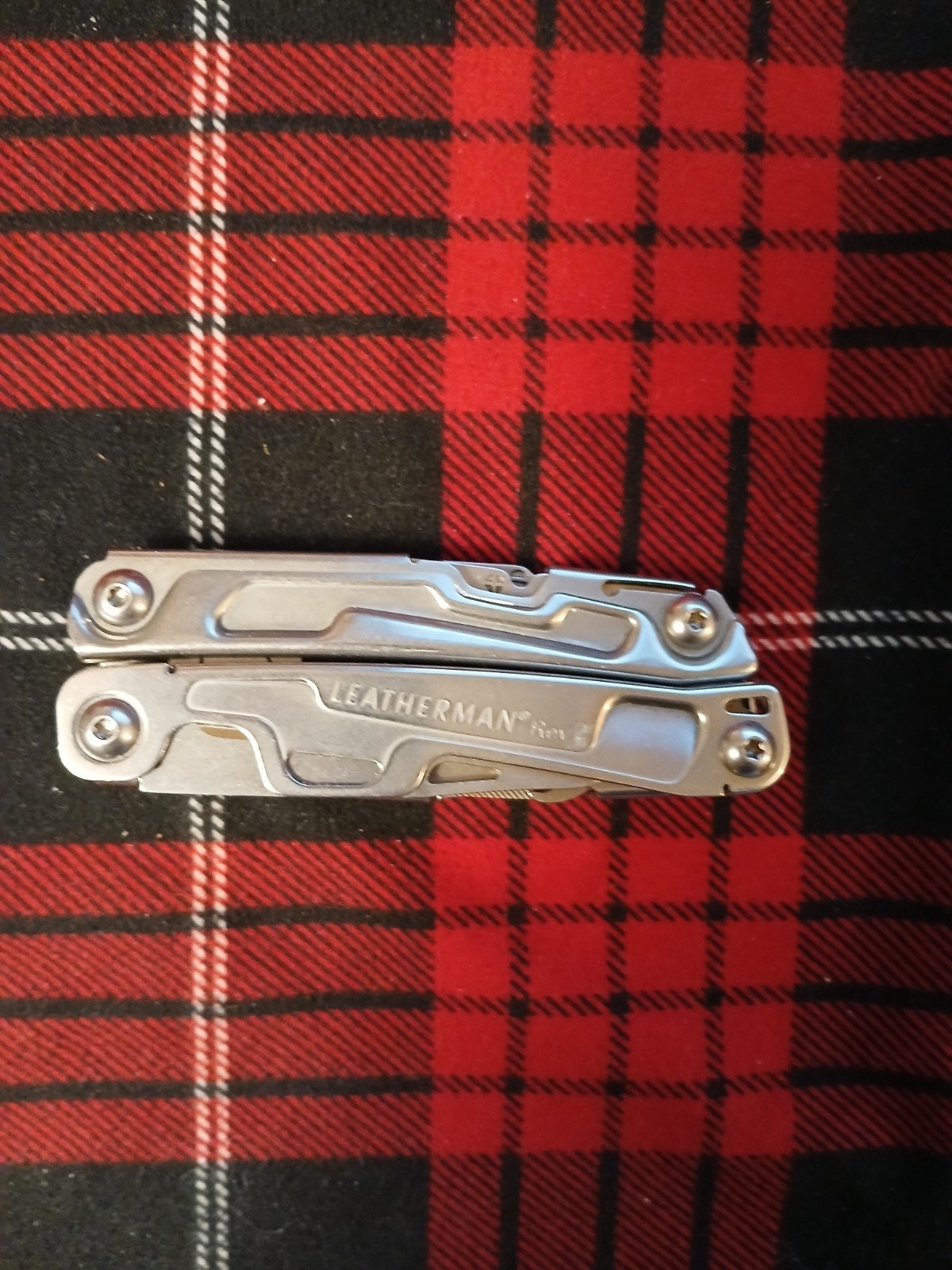 Leatherman Rev Multi-Tool with MO Welded on the surface