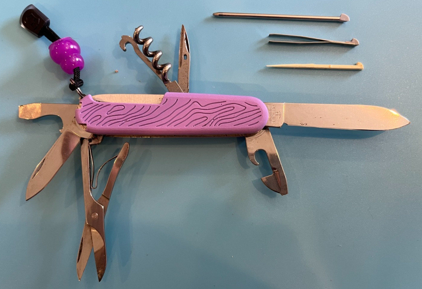 Victorinox Custom Multitool+, General Suisse bld, Purple w/ lanyard & glo bead