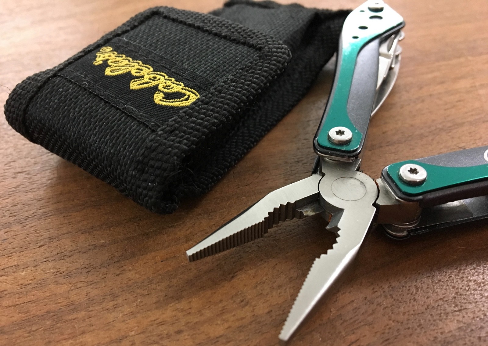 Cabela’s multi tool in hunter green with sheath for camp, hunt, survival, crafts
