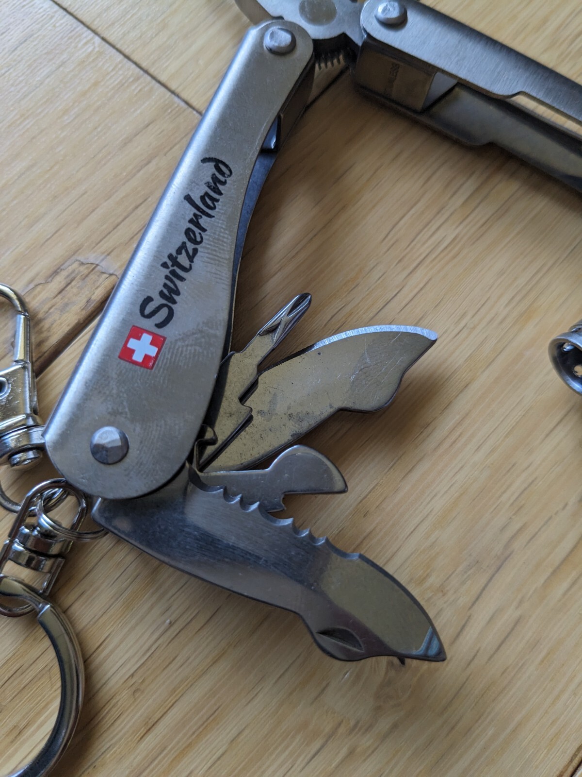 Swiss-Made Foldable Pocket Multi-Tool Stainless Steel w Pocket Clip. 8 Functions