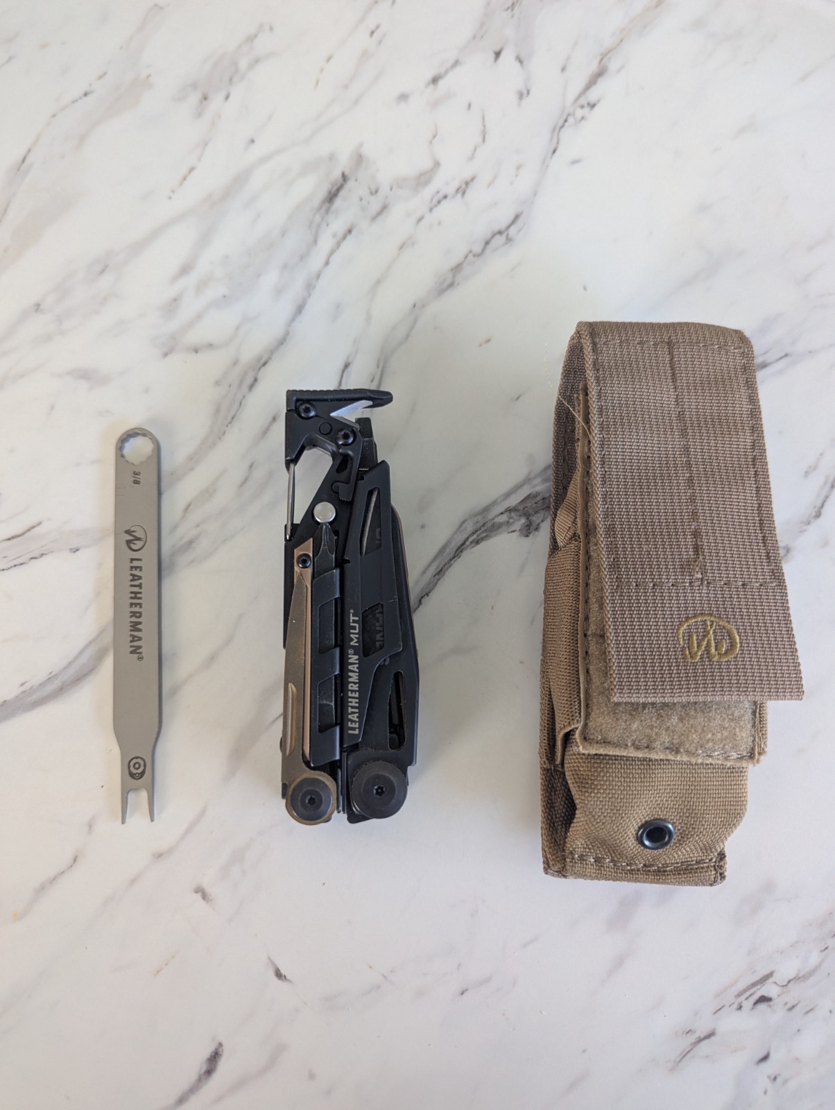 Leatherman MUT Black multi tool with Brown/Tan Inserts. Very good condition.
