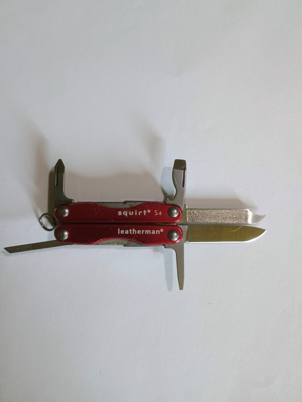 Leatherman Squirt S4 Multi-Tool. Red. Used