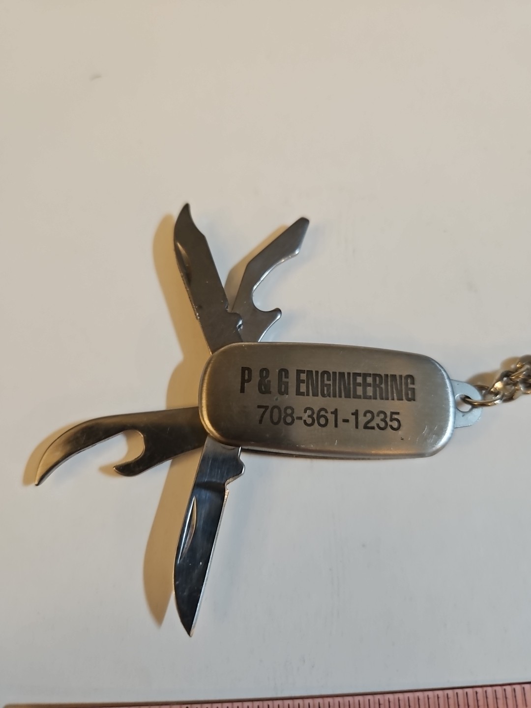 multi tool key chain stainless steel With P&G engineering On It.