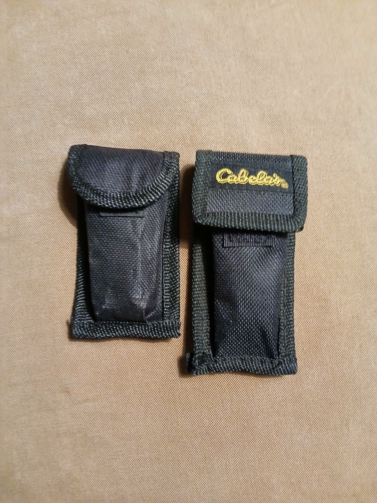 2) Cabela’s Multi-tool with nylon case unused