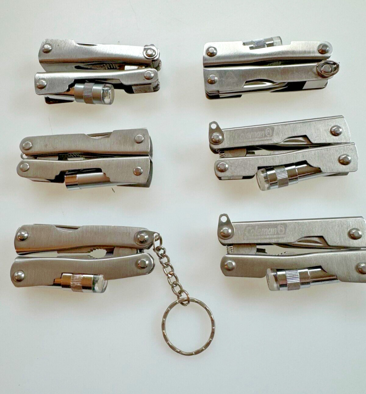 Lot of 6 Multi Tools (branded Coleman, etc.), Good Condition
