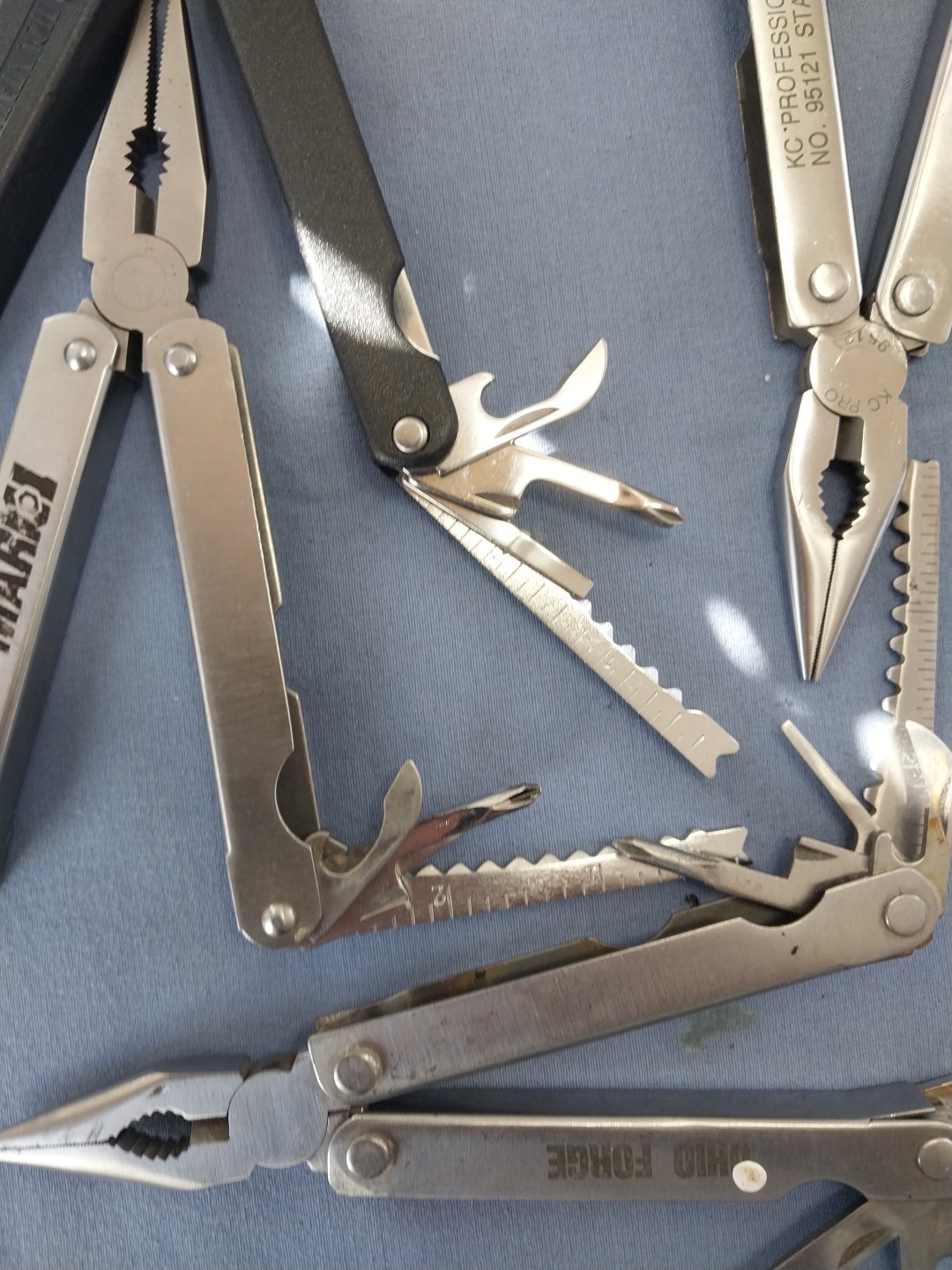 4 multi tools pliers screwdriver knife saw