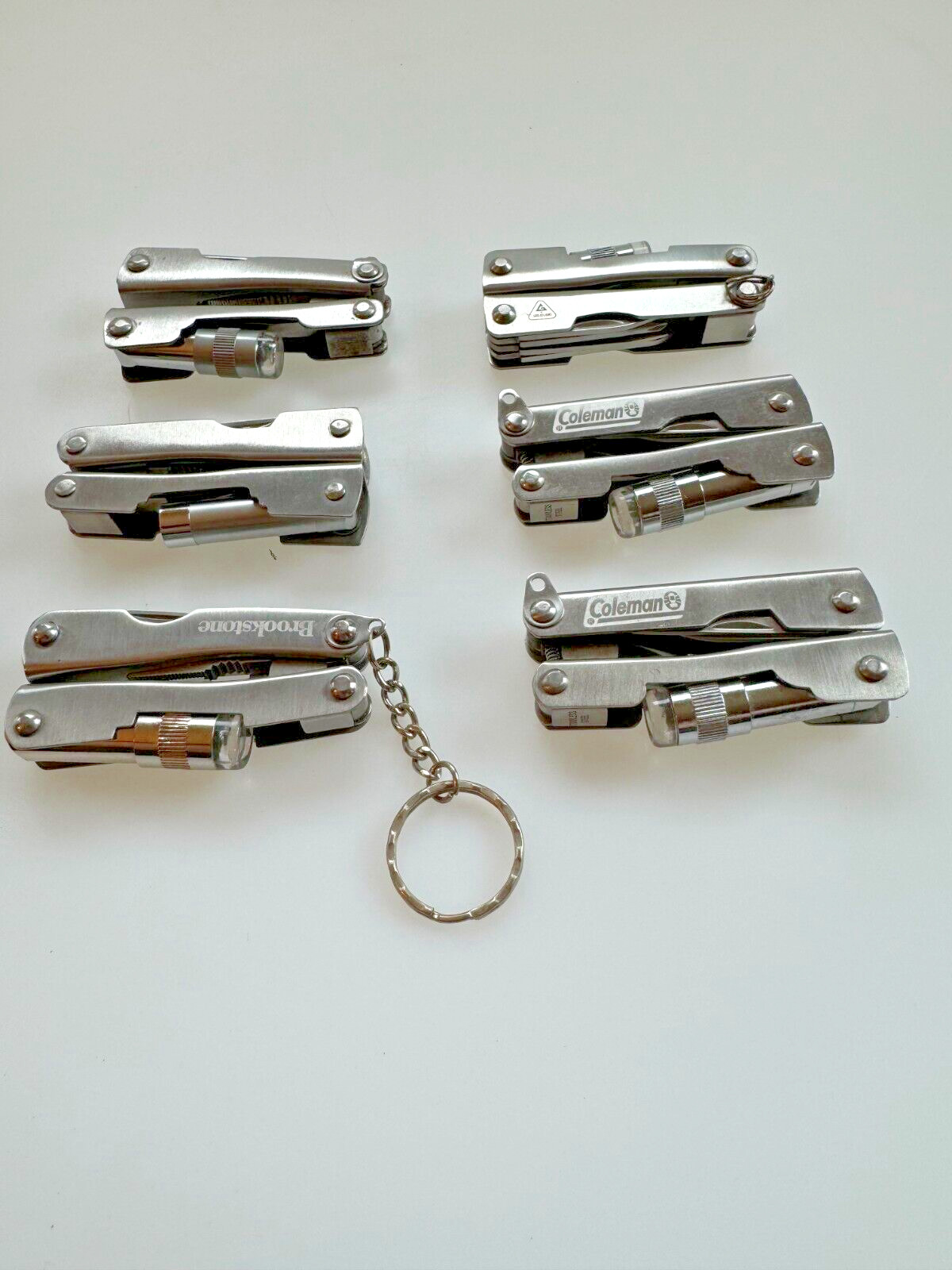 Lot of 6 Multi Tools (branded Coleman, etc.), Good Condition