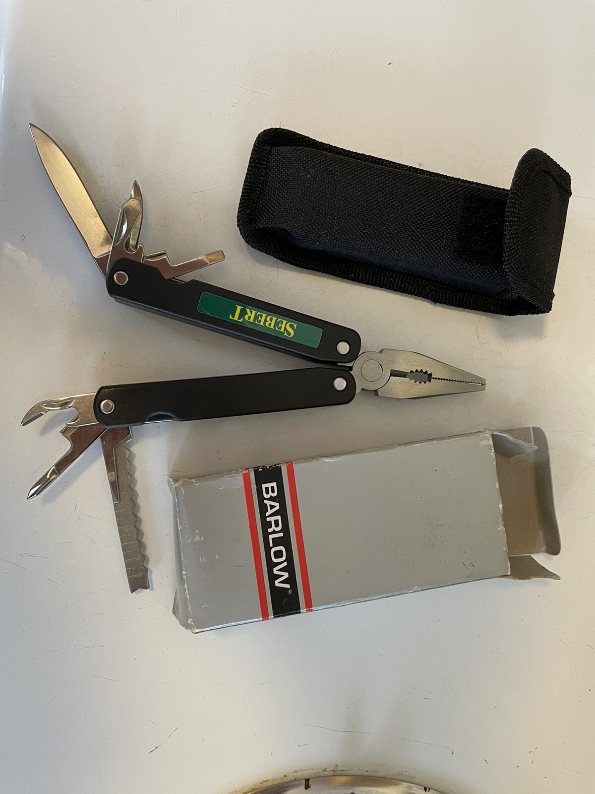 Barlow multi tool. New In Box With Pouch. Sebert Landscaping Logo.