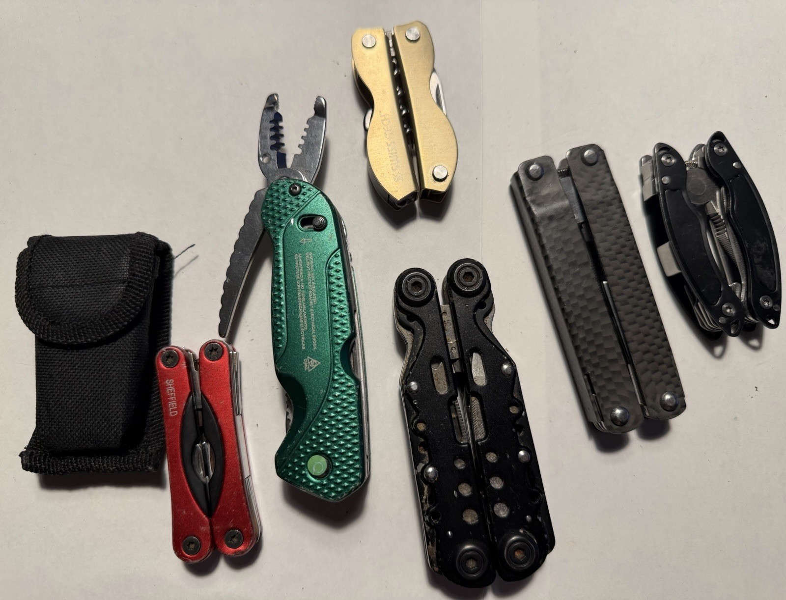 Great Deal! Lot Of 7 Multi Tools Electricians Pliers Cork Screw Blade File Etc