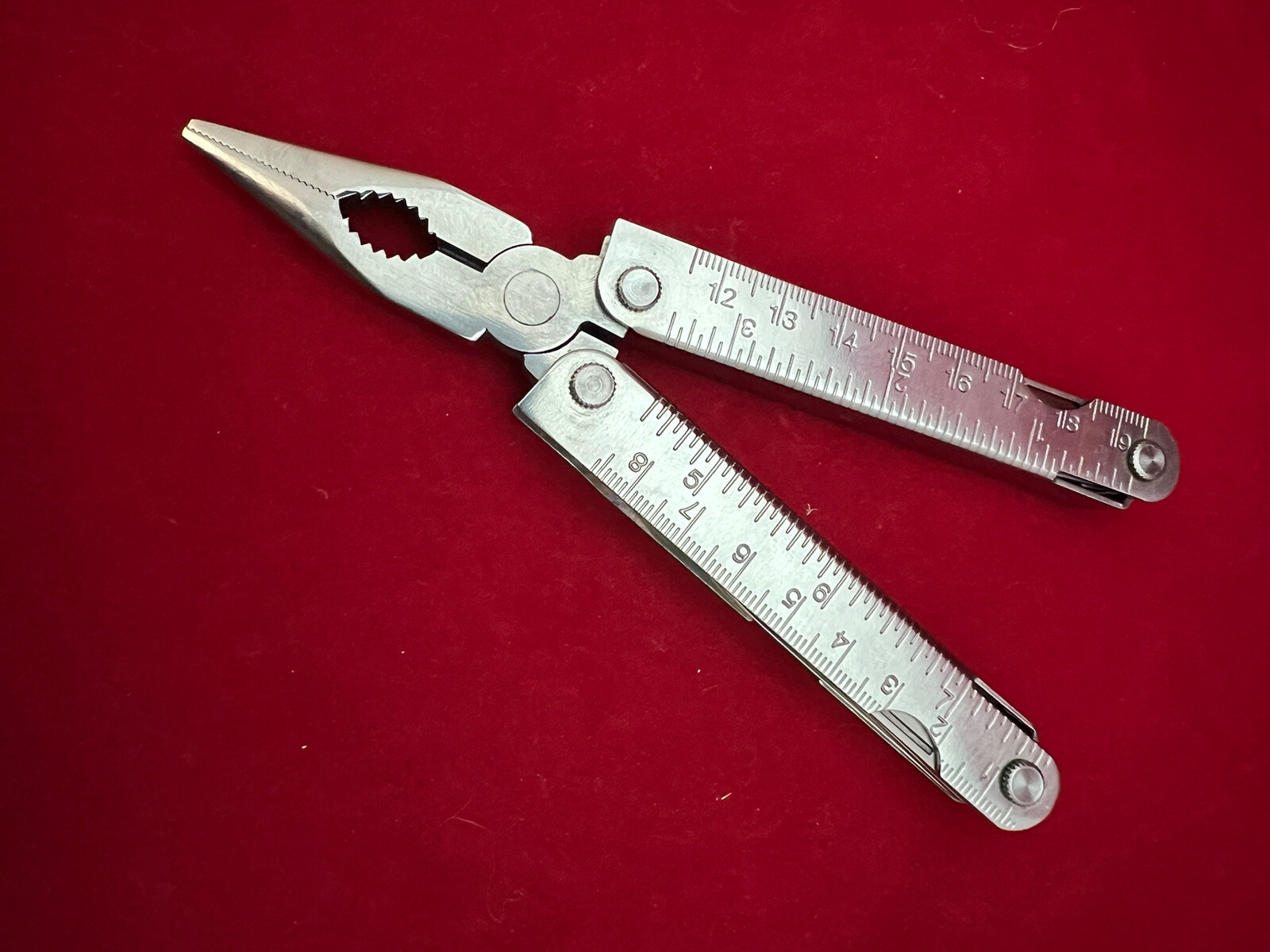 Stainless Steel 12-in-1 Multi-Tool – Pliers Knives Screwdrivers File Saw Opener