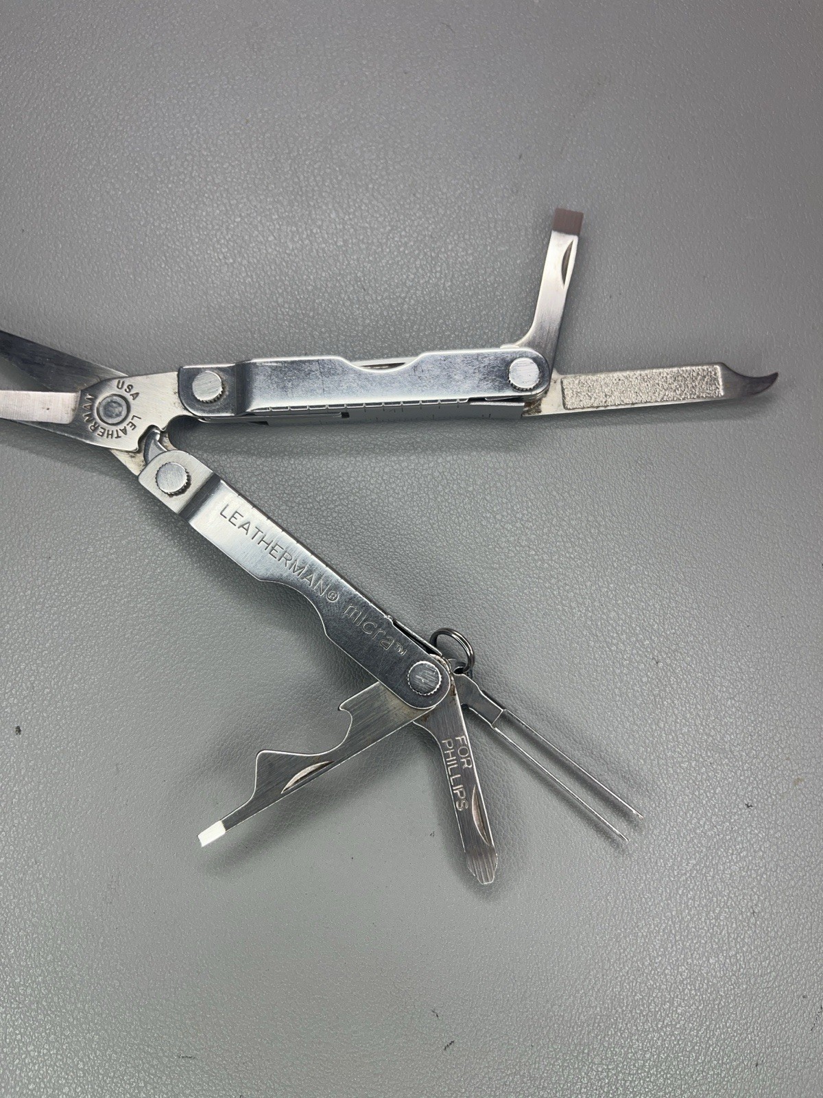 Leatherman Micra keychain multi-tool with sheath. USA