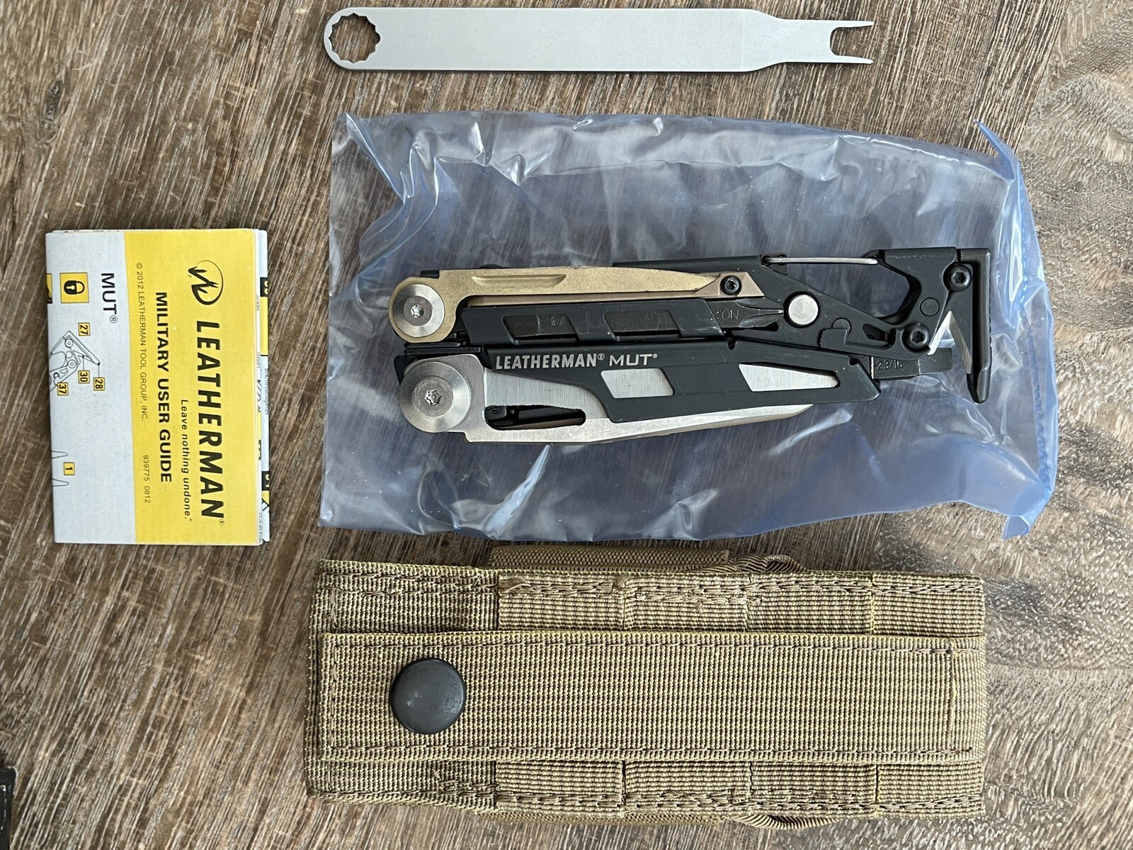 Leatherman MUT w/Titanium Clip multi tool, dark brown molle sheath. Vintage 2013