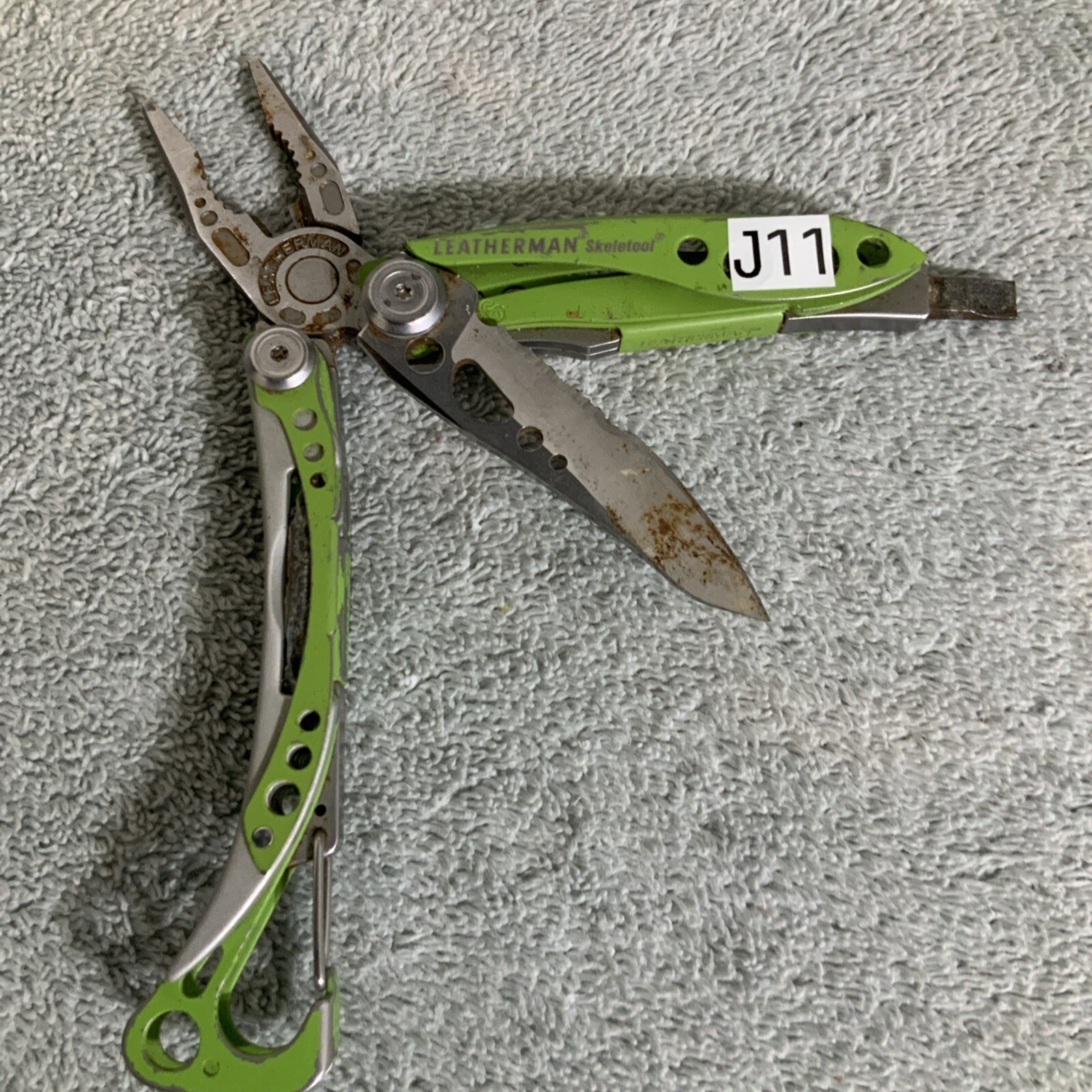 Retired Leatherman “Skeletool Lime Green” Stainless Steel Multi Tool Rust – J11