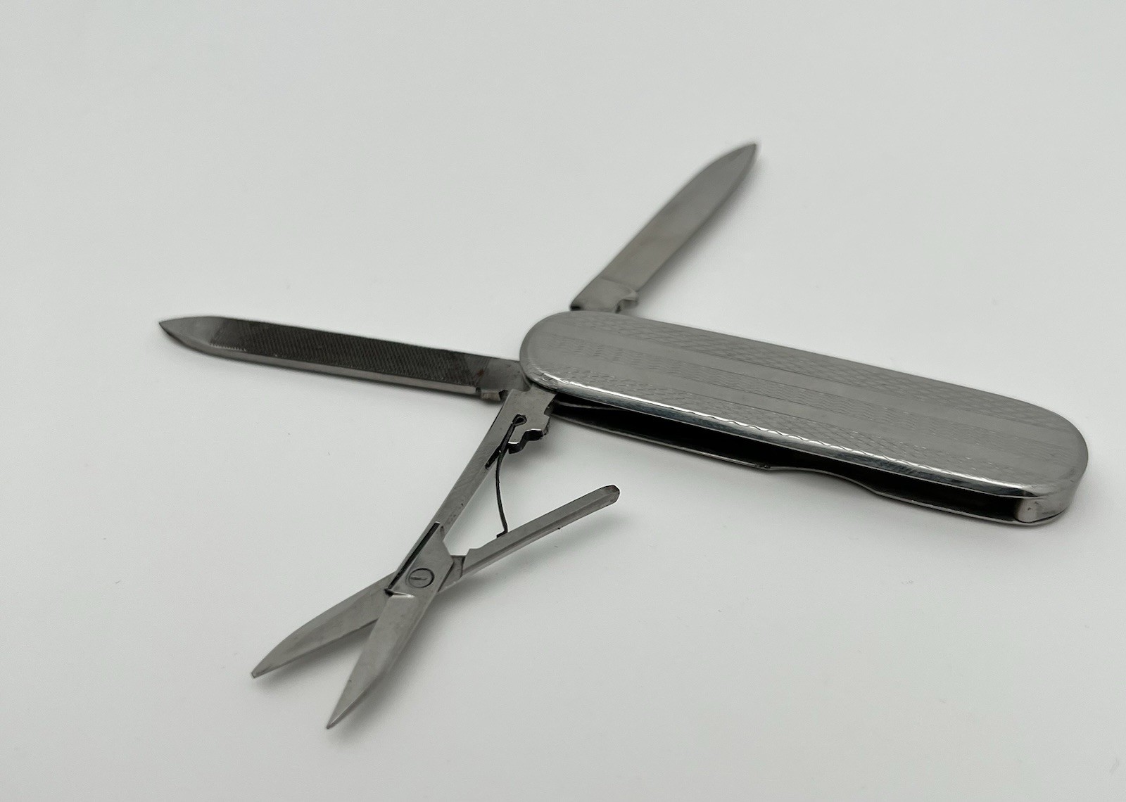 Multi-tool with blade, scissors and file