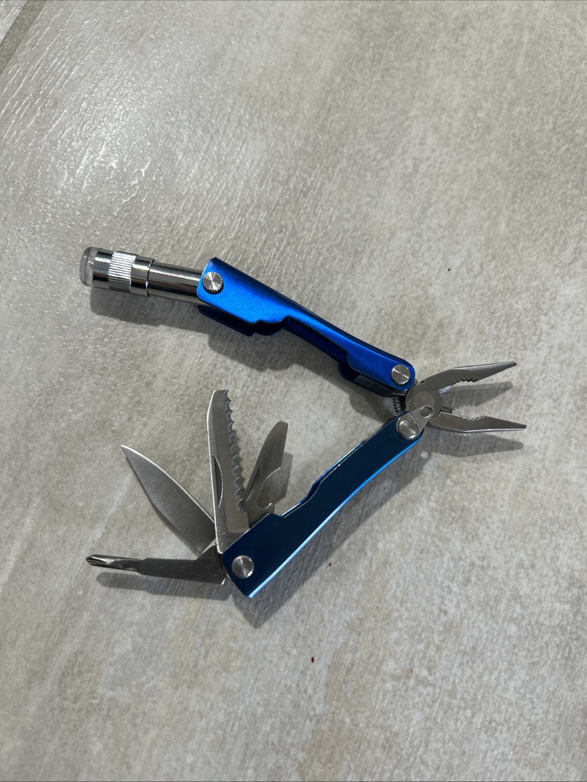 PROTOCOL 8 FUNCTION MINI MULTI TOOL WITH SHEATH – Pliers, Flashlight, Etc.