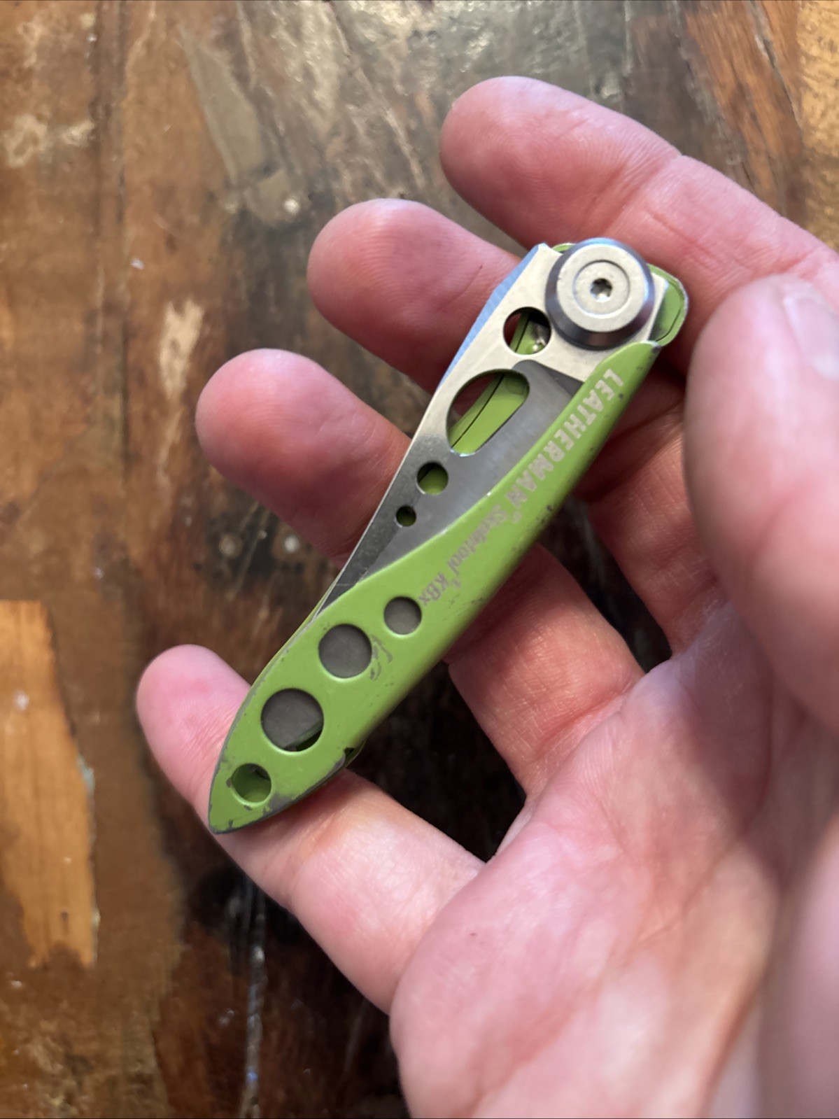 LEATHERMAN Skeletool KBX Multitool, Stainless Steel Lime Green 1/2 Serrated Edge