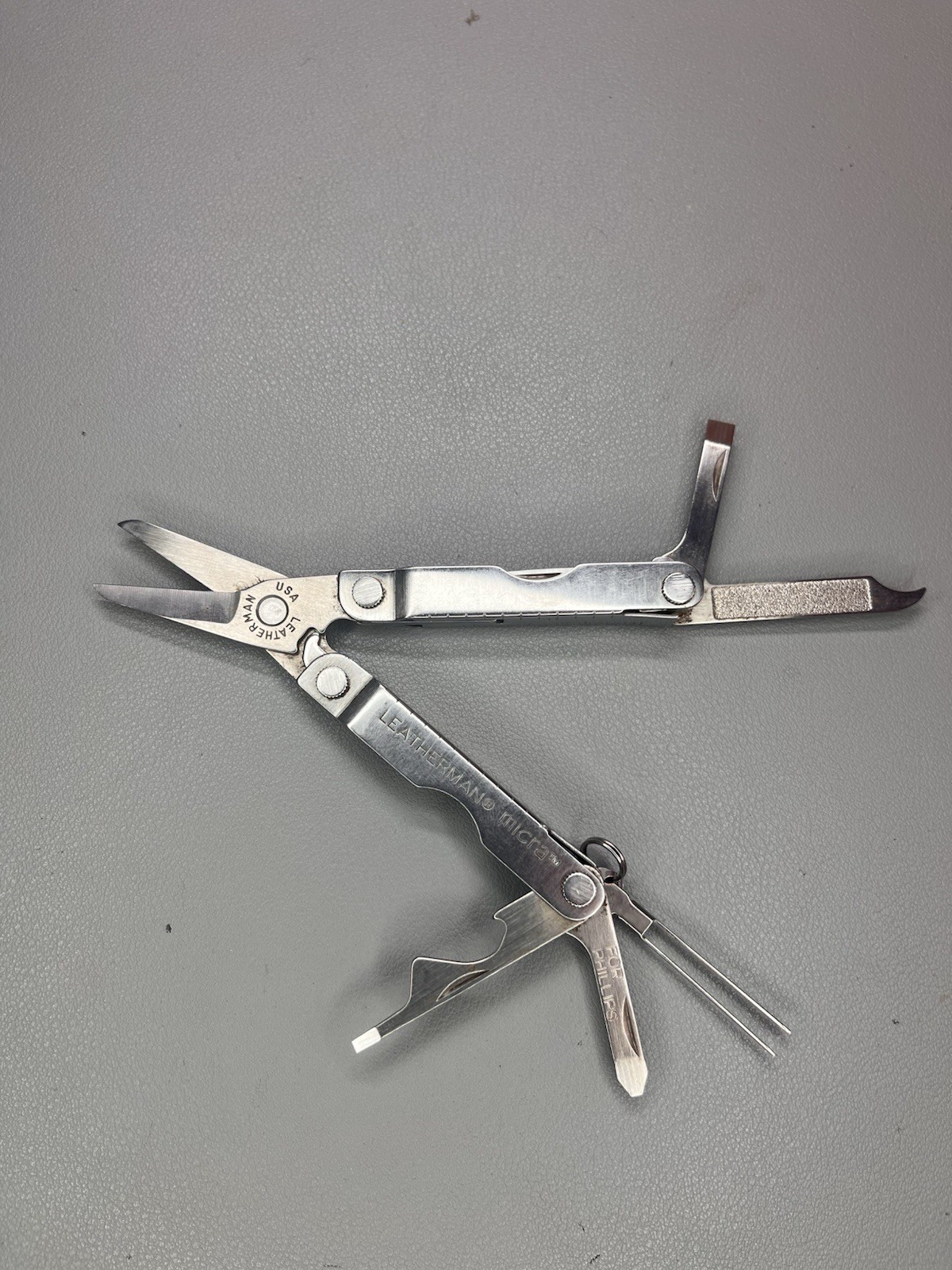 Leatherman Micra keychain multi-tool with sheath. USA