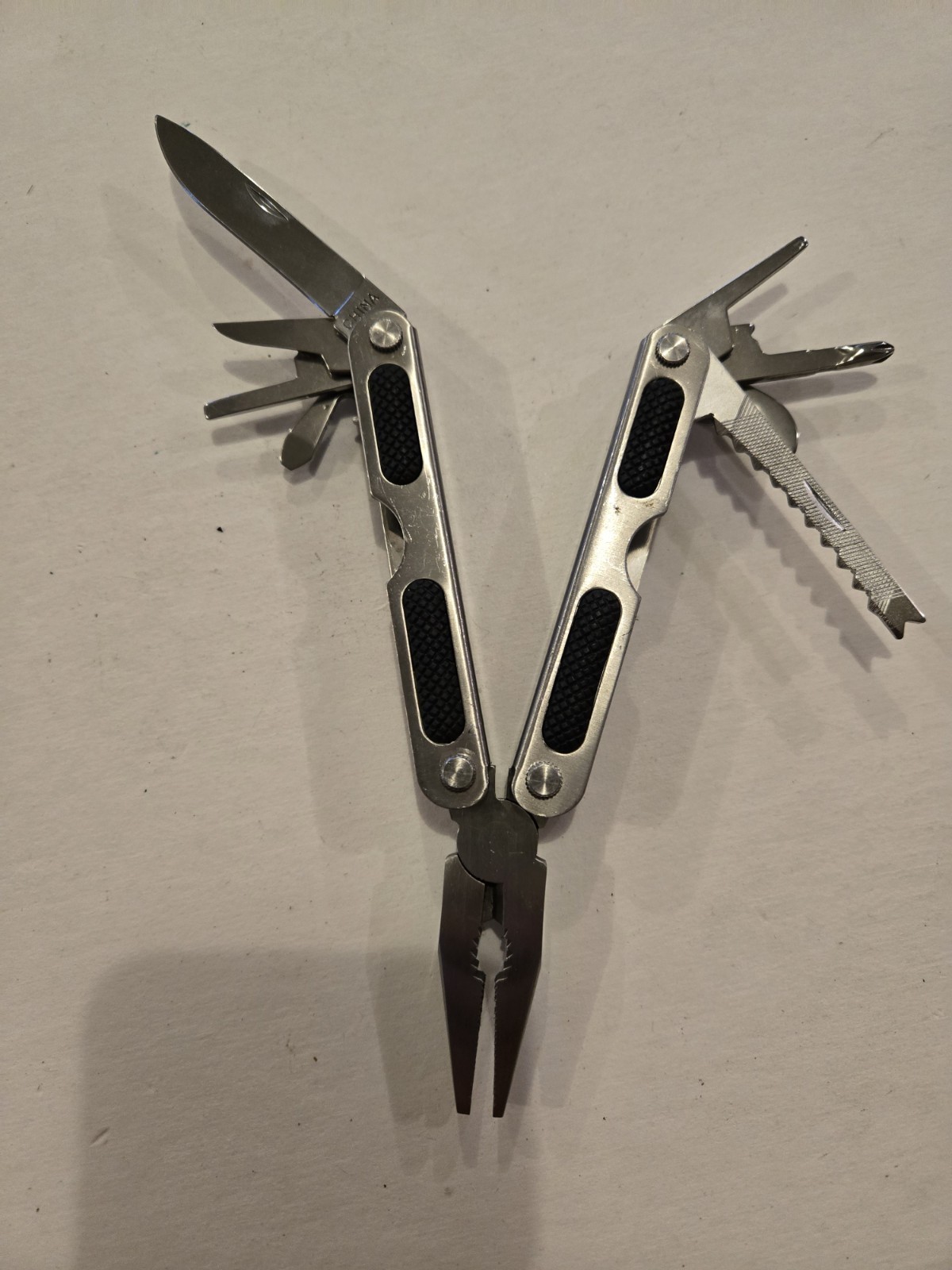 Gander Mountain 10-in-1 Multi Tool, Silver With Black Rubber Inlay Handles