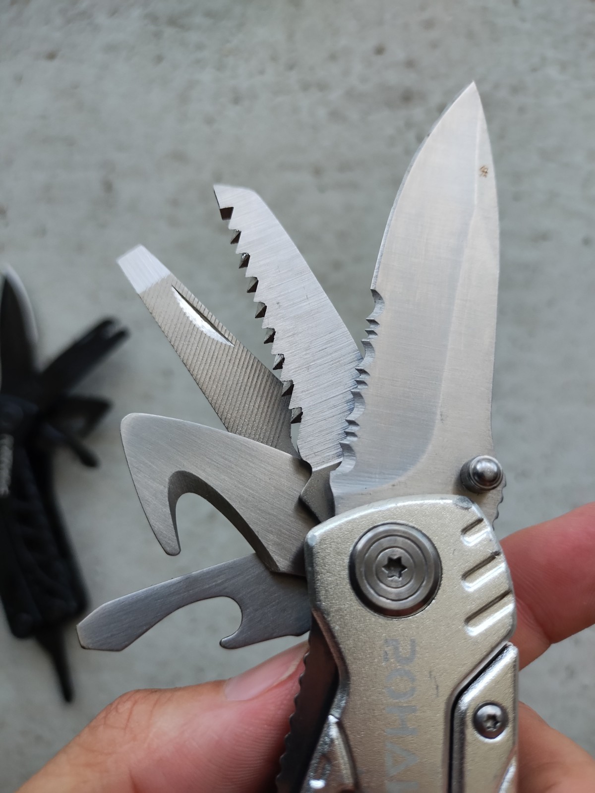 POHAKU BLACK & SILVER MULTI TOOL PLIERS KNIFE, SAW BLADE, FILE, ETC. LOT OF 2