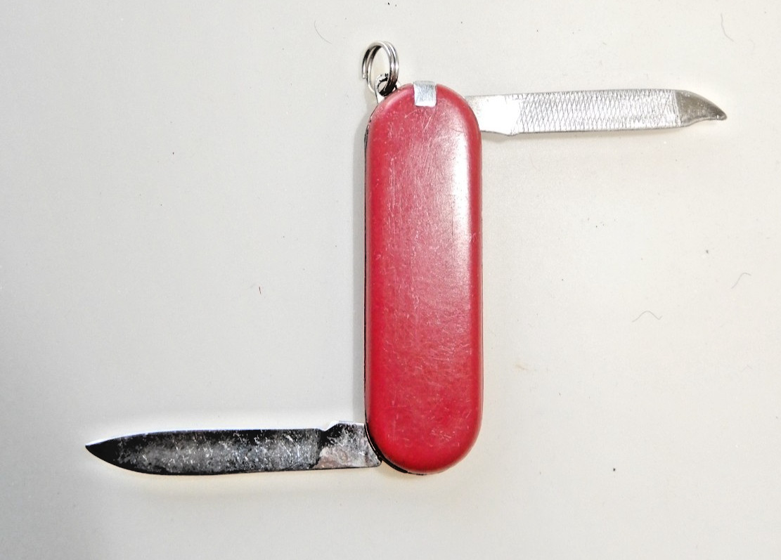 Unbranded Chinese Knock-Off red multitool, tweezers, toothpick