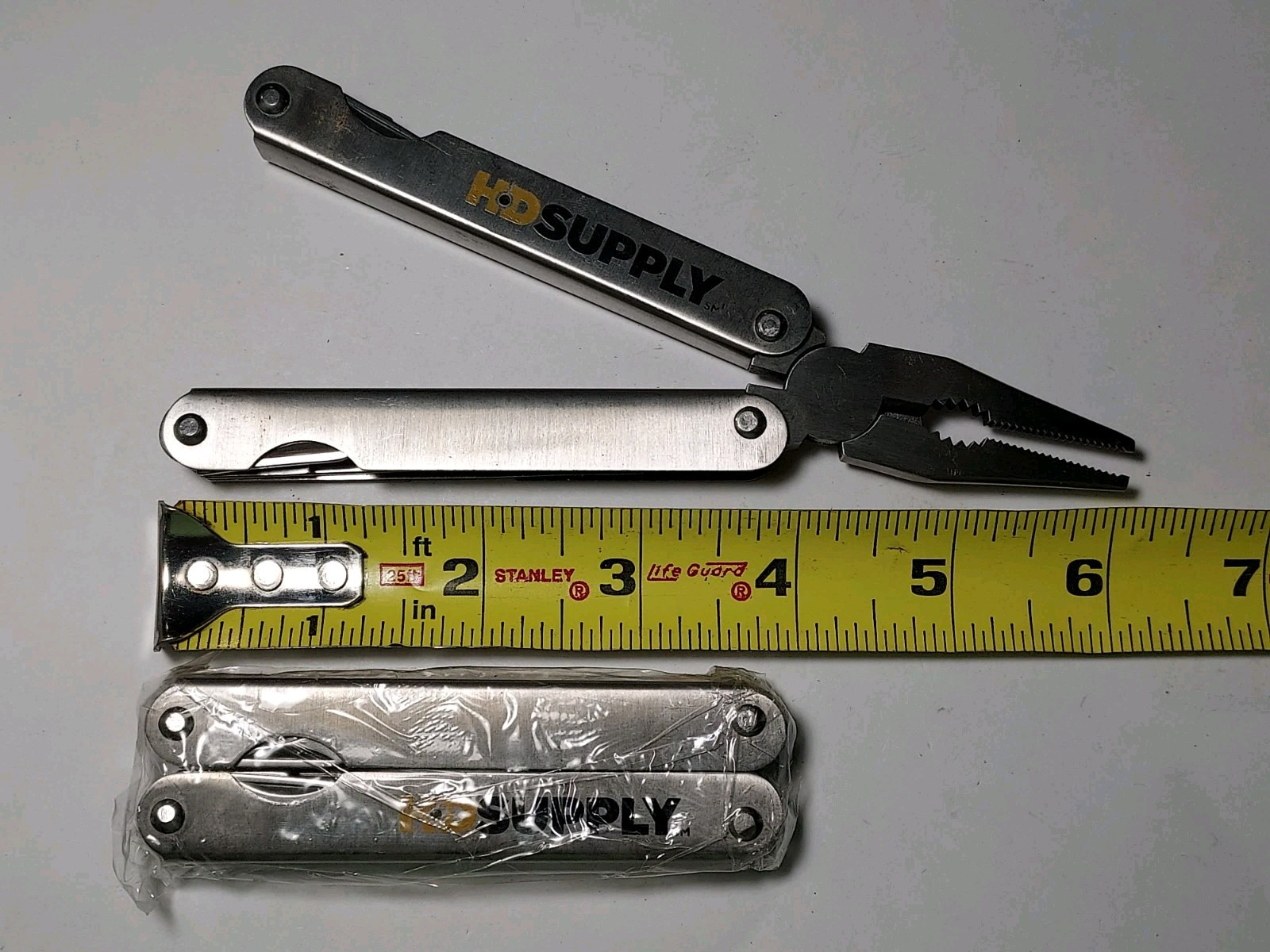 2 HD Supply Multi Tools with Nylon Pouch – 1 used, 1 new