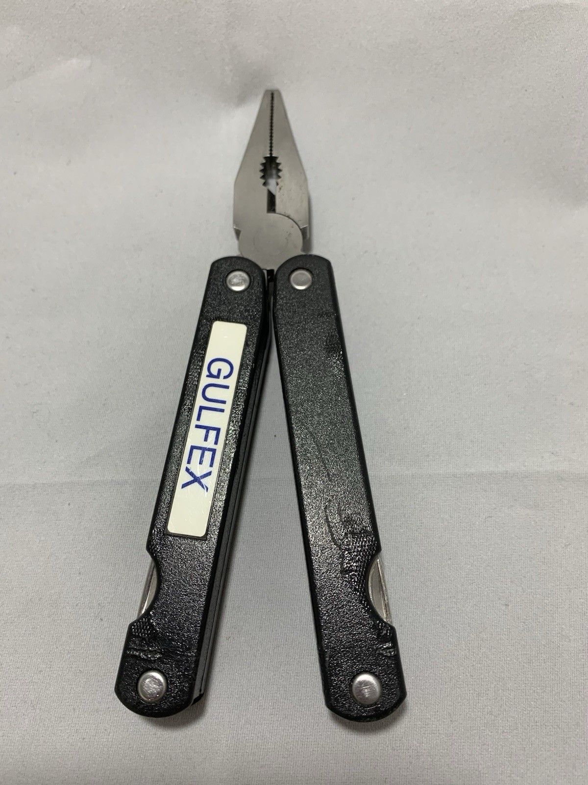Barlow SuperPliers multi-tool featuring black handles with a “GULFEX” label