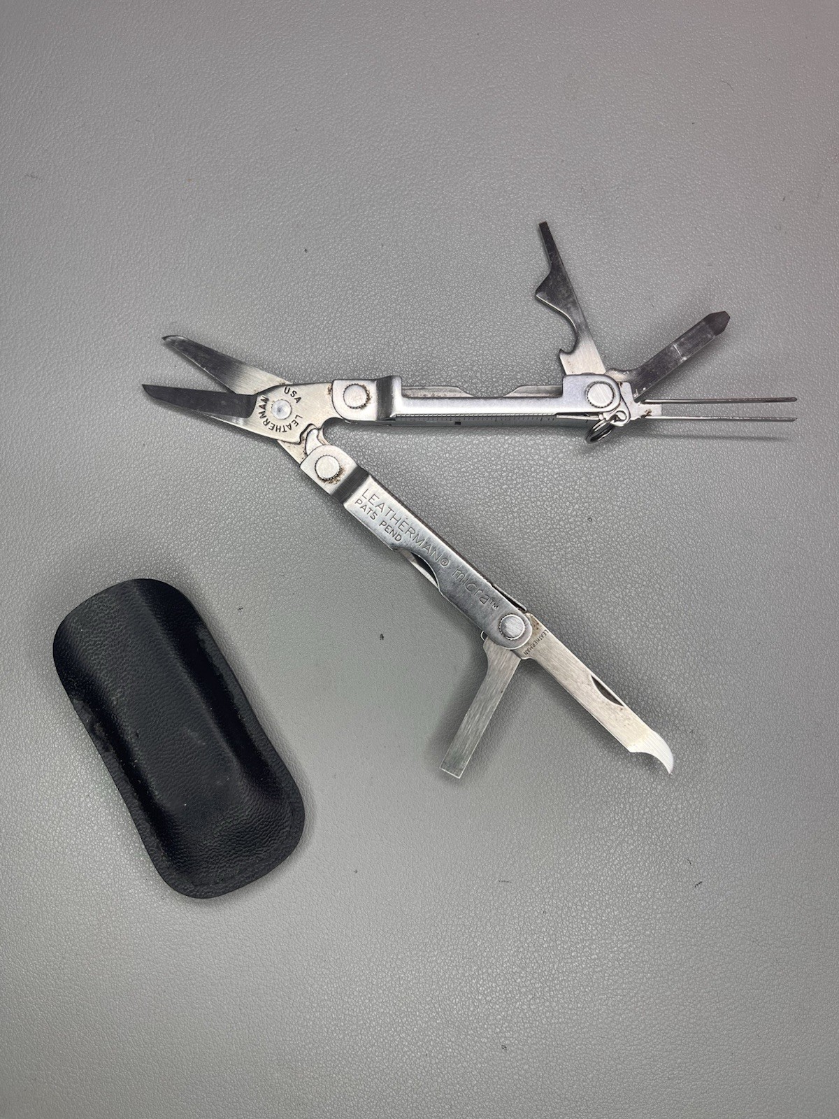 Leatherman Micra keychain multi-tool with sheath. USA