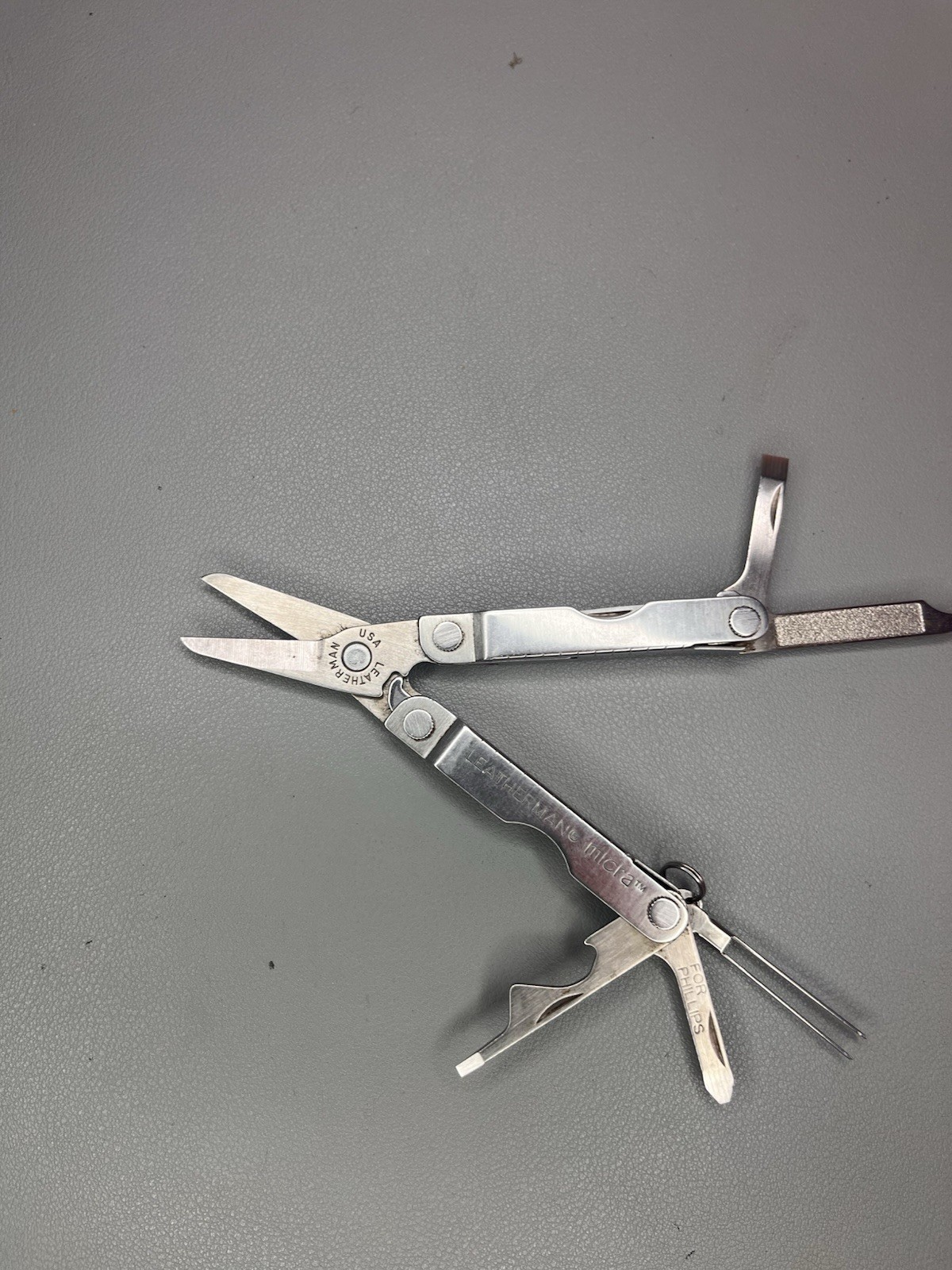 Leatherman Micra keychain multi-tool with sheath. USA