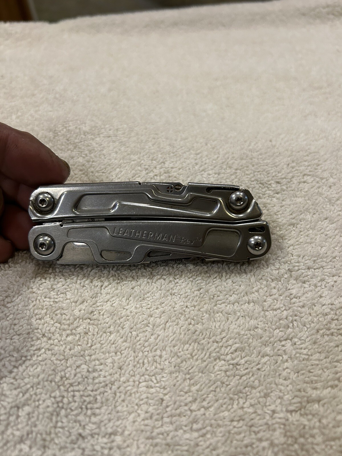 Leatherman Rev multitool with company logo