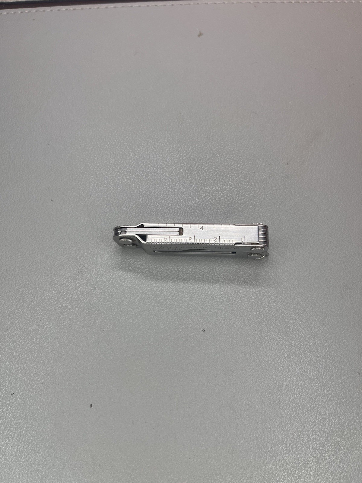 Leatherman Micra keychain multi-tool with sheath. USA