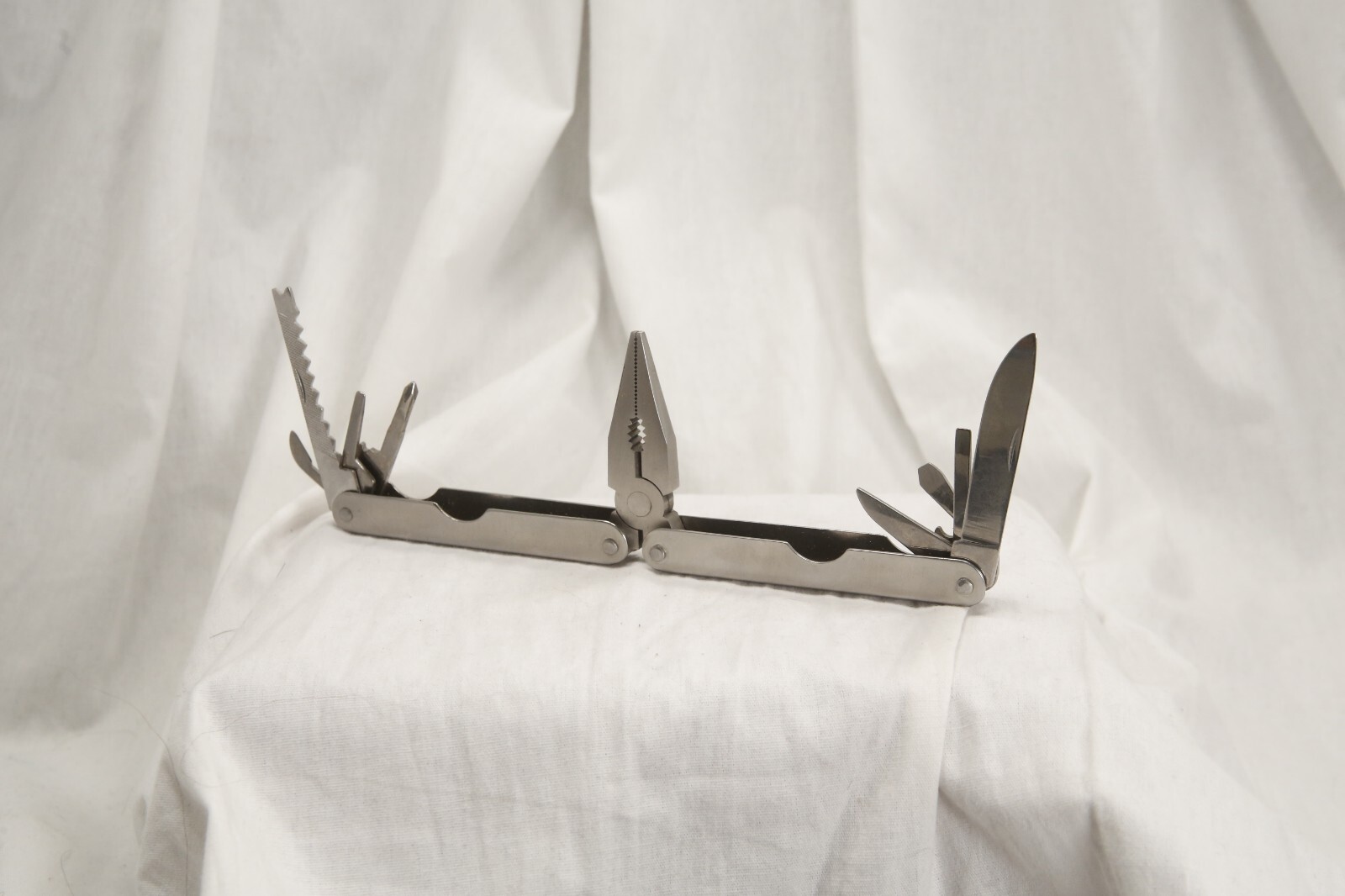 High Uinta Gear, multitool and canvas case, sliver 4.5 inches x 1.75 inches