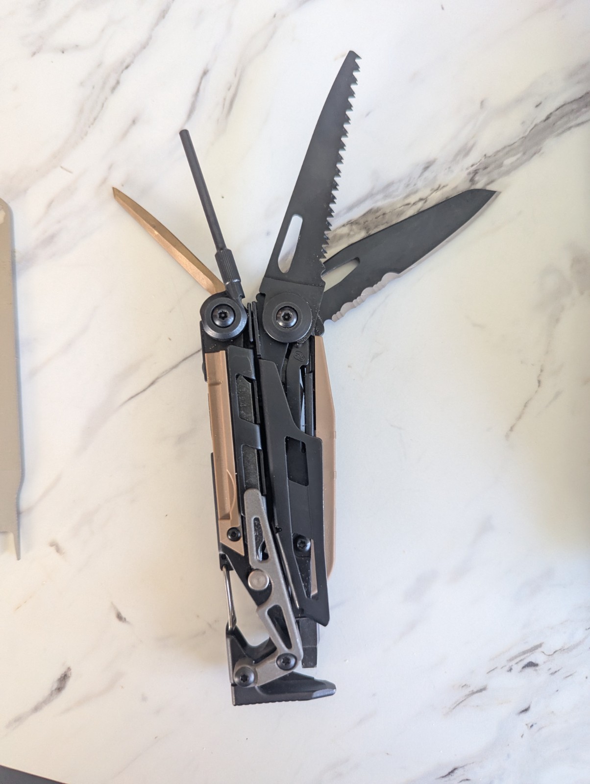 Leatherman MUT Black multi tool with Brown/Tan Inserts. Very good condition.