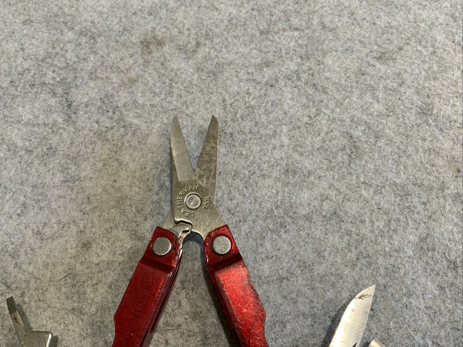 Leatherman Micra Multi Tool Red Transparent Plastic Coating Chipped