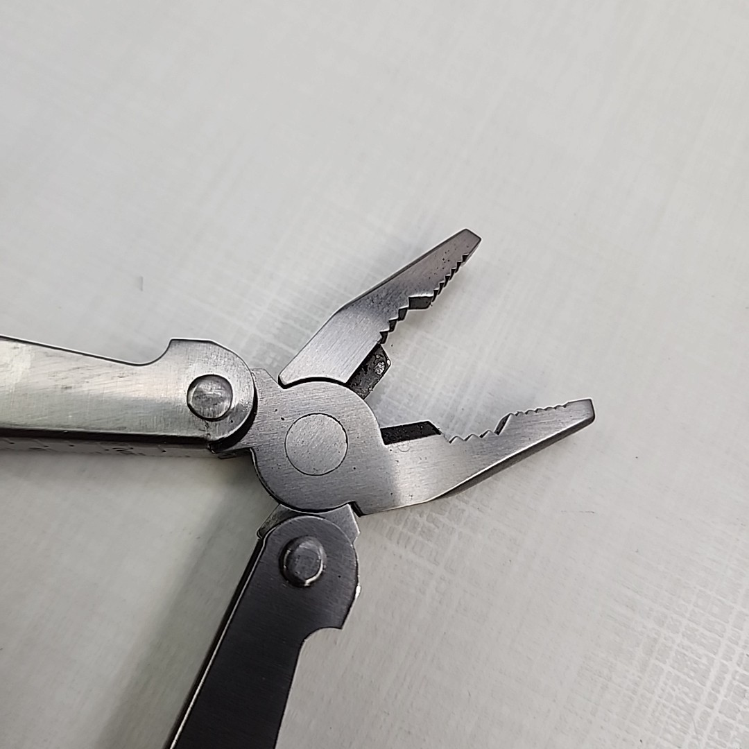 Pocket multi tool unbranded, plier, knife, file, screw drivers, awl, can opener