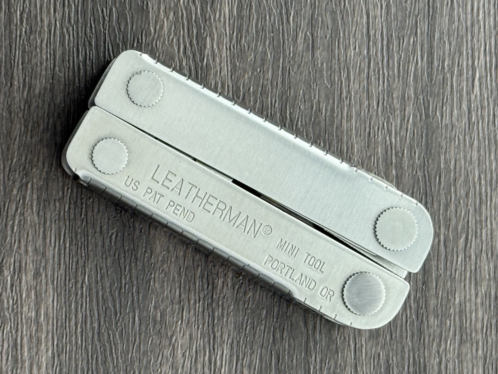 Leatherman MINI TOOL multitool. US PAT PEND w/Pliers Precision Alignment Hole!