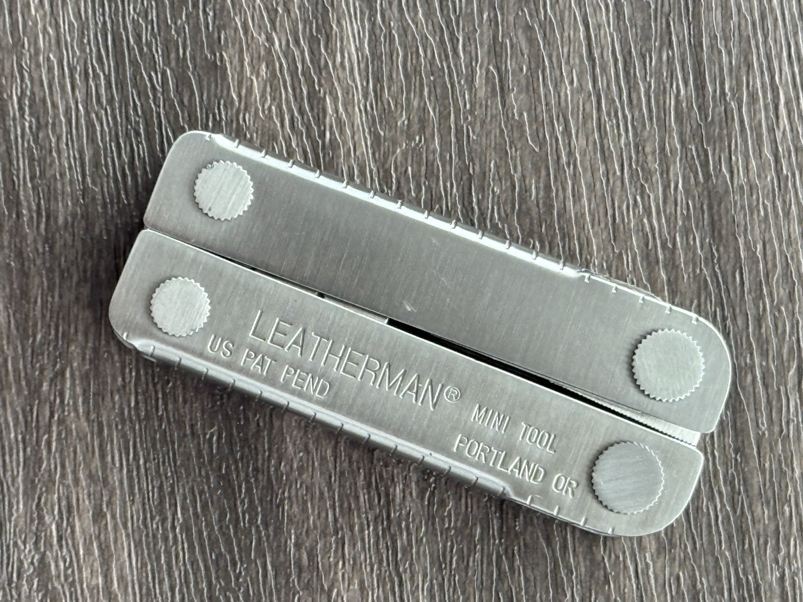 Leatherman MINI TOOL multitool. US PAT PEND w/Pliers Precision Alignment Hole!