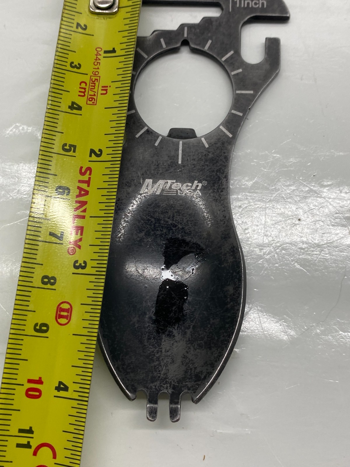 Compact MTech USA stainless steel survival spork multi-tool designed for camping