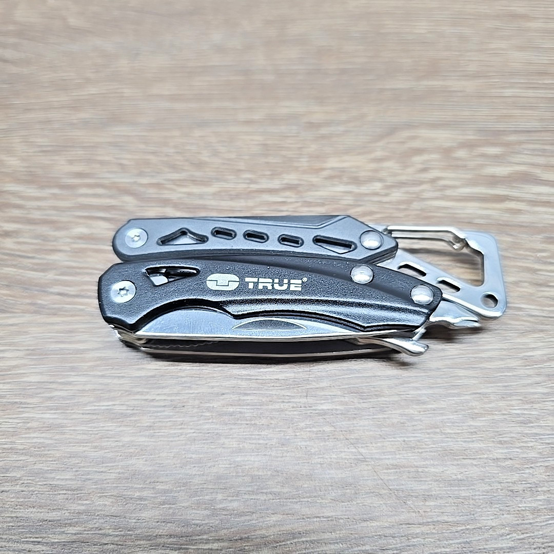 True Utility TU180F Seven Multi-Tool Saw Knife Wire Cutters Pliers Screwdriver..