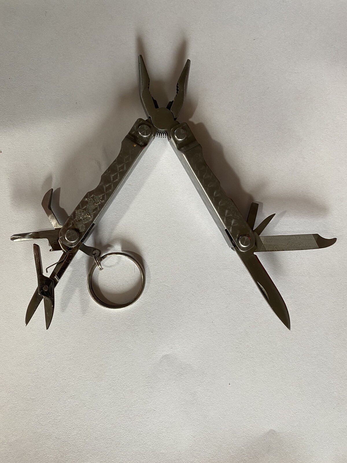 Lot of 2 Multitools w/ pliers blade file saw flash light scissors etc.