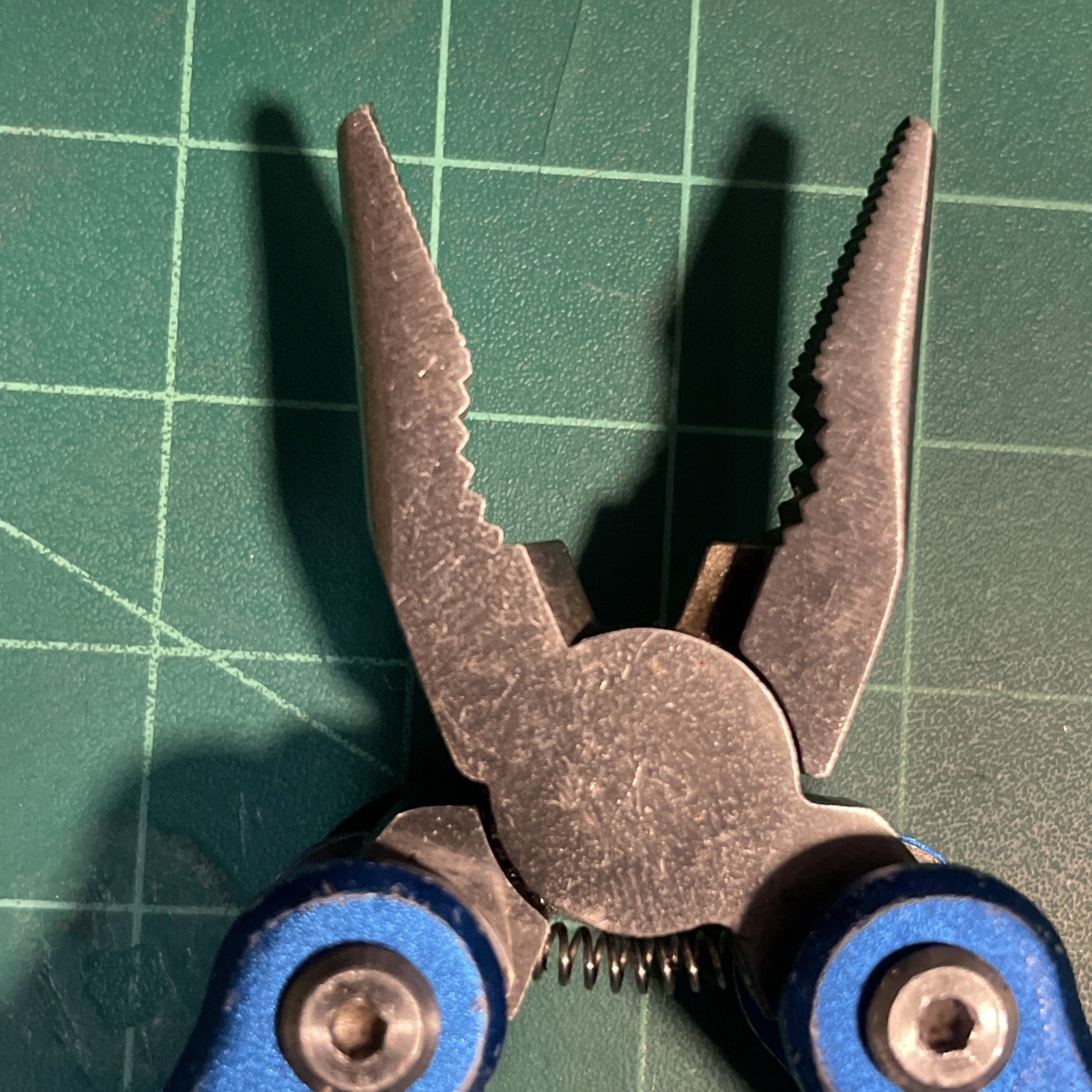Blue Mini Multi Tool = pliers, knife, wire cutter, screwdrivers, files, etc.