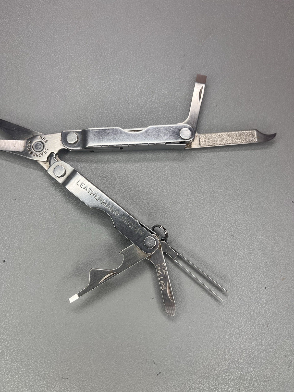 Leatherman Micra keychain multi-tool with sheath. USA
