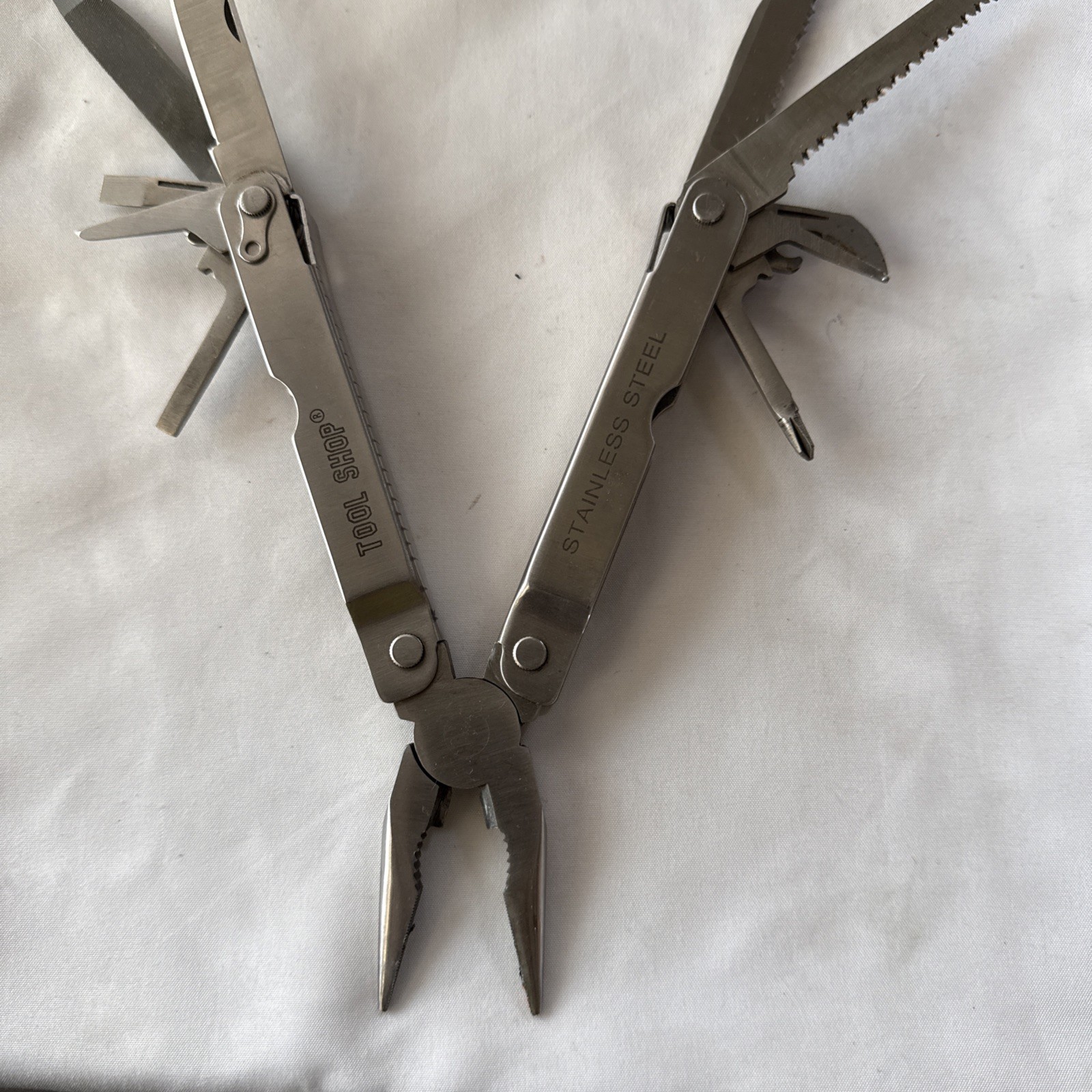 Tool Shop, multitool 13 tools plus!!! Nice tool!!! Not branded Stainless Steel