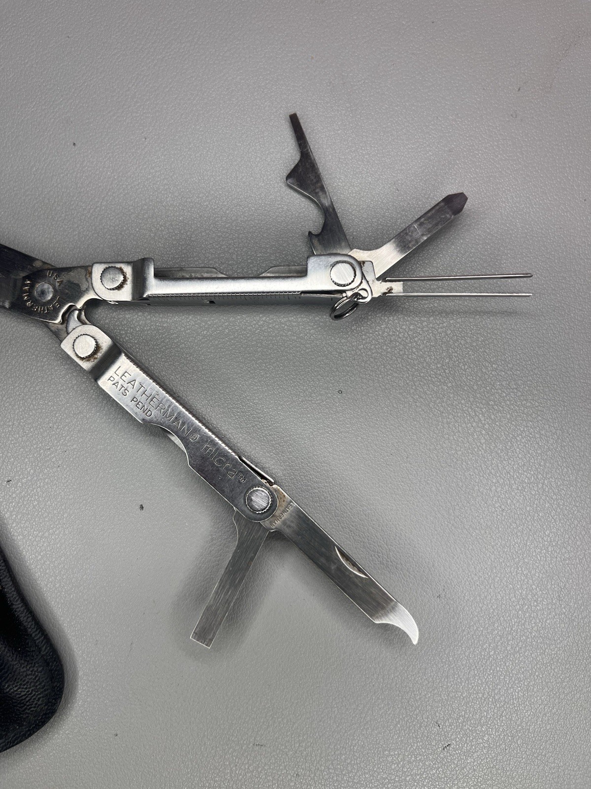 Leatherman Micra keychain multi-tool with sheath. USA